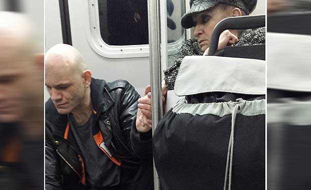 Elderly Woman Comforts Aggressive Transit Rider With Touching Gesture