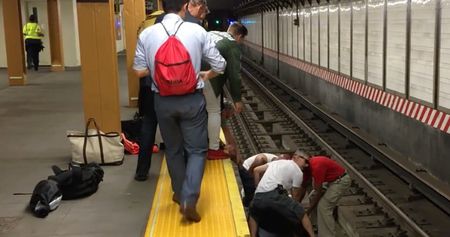 Watch the Rescue of an Unconscious Man Who Fell Onto Subway Tracks