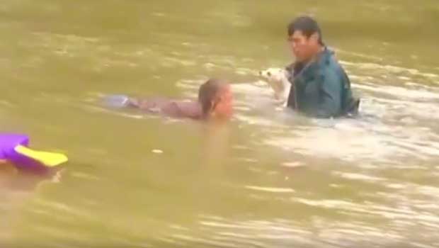 Man Rescues Woman and Her Dog as Car Sinks in Incredible Video
