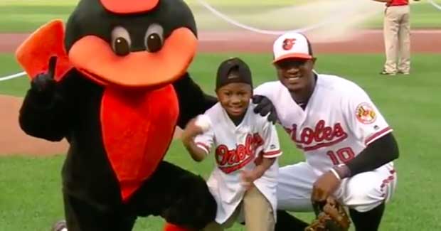 9-Year-Old Throws First Pitch One Year After Receiving First Ever Double Hand Transplant