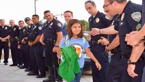 Police Officers Give Big Surprise to Girl Whose Father Was Killed on Duty