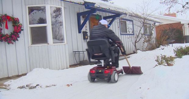 Viral Picture Shows an Inspirational Man With MS Stopping at Nothing for a Snowstorm