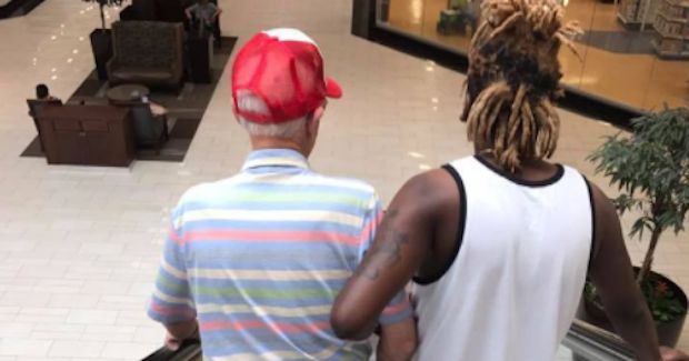 Viral Photo Shows Off a Generous Stranger Helping an Elderly Man Down an Escalator